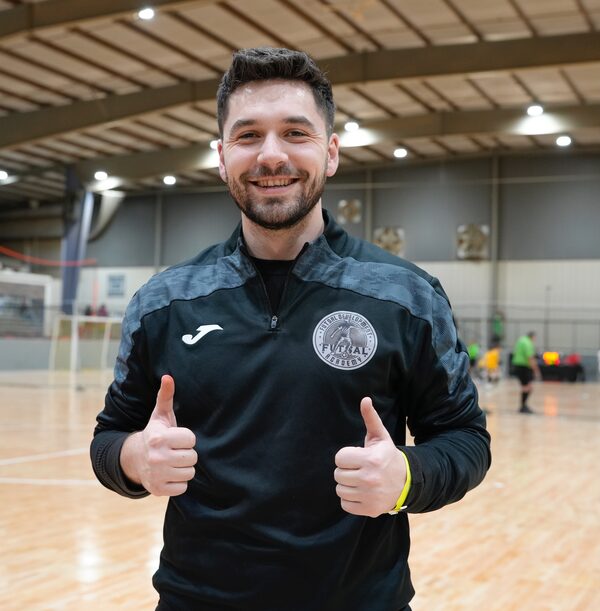 Coach Art Termkolli giving two thumbs up