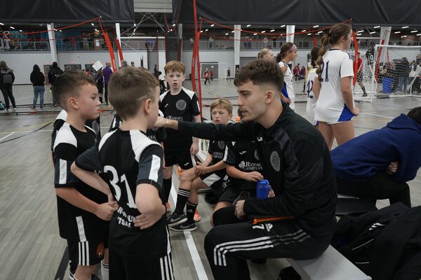 Coach Edvin Habibovic instructing players at a tournament
